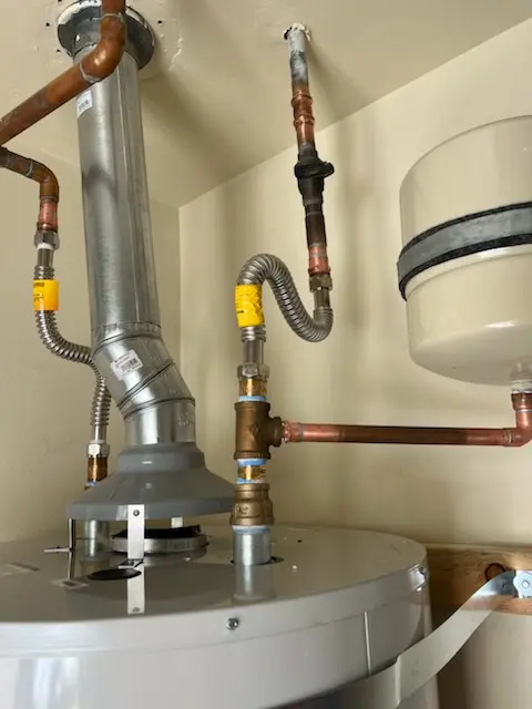 Water heater installation and plumbing repair in Image